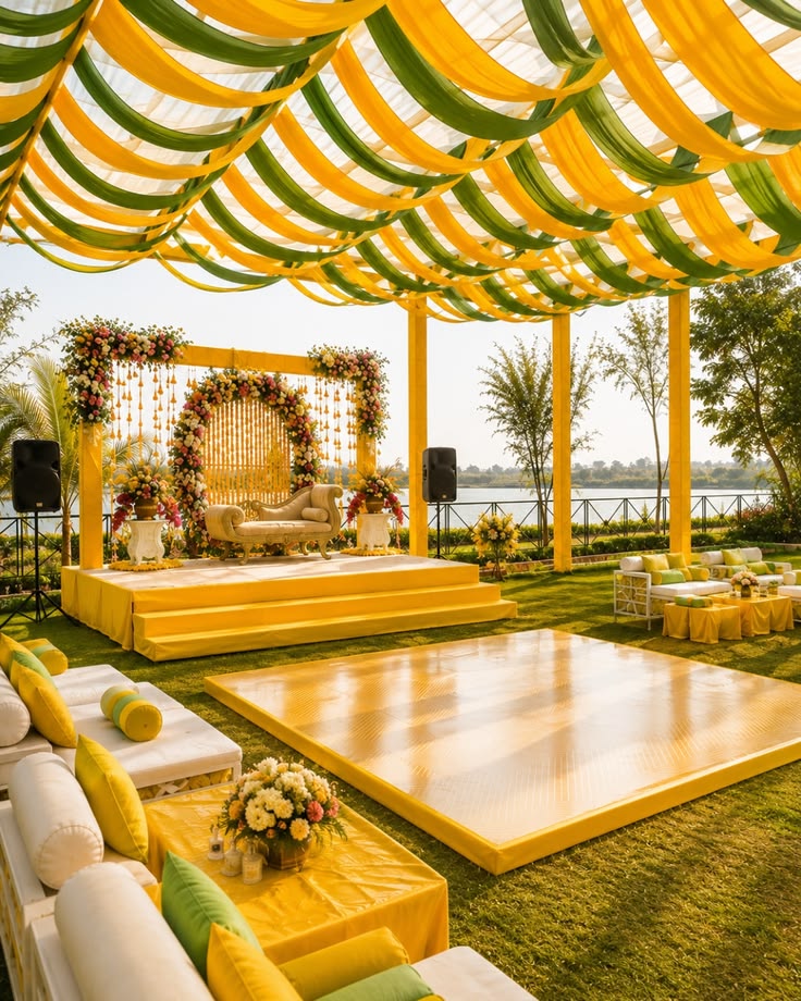 A vibrant Haldi setup adorned with marigolds and traditional details