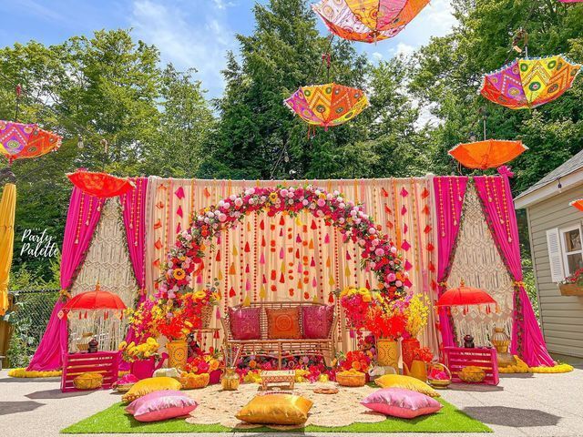Bright hues and delicate décor creating a joyful Mehndi setting